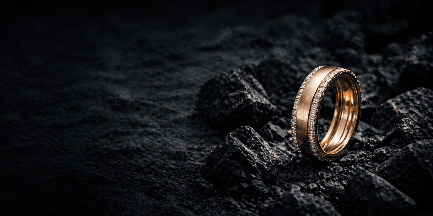 Rose gold pavé eternity band on dark stone